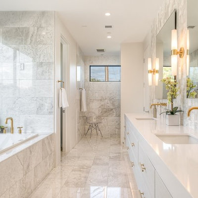 Inspiration for a mid-sized transitional master white tile marble floor bathroom remodel in Phoenix with flat-panel cabinets, white cabinets, an undermount sink, white walls, quartz countertops and white countertops