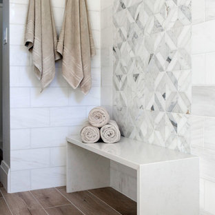 Bathroom - large farmhouse master white tile and marble tile porcelain tile and brown floor bathroom idea in Portland with shaker cabinets, beige cabinets, a one-piece toilet, multicolored walls, an undermount sink and quartz countertops