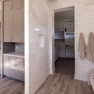 Inspiration for a large cottage master white tile and marble tile porcelain tile and brown floor bathroom remodel in Portland with shaker cabinets, beige cabinets, a one-piece toilet, multicolored walls, an undermount sink and quartz countertops