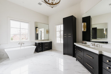 Large transitional master white tile and marble tile white floor and double-sink bathroom photo in Oklahoma City with furniture-like cabinets, black cabinets, white walls, quartz countertops, white countertops and a built-in vanity