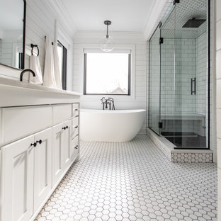 Bathroom - large farmhouse master white tile and subway tile ceramic tile, white floor, double-sink and shiplap wall bathroom idea in Minneapolis with shaker cabinets, white cabinets, a two-piece toilet, white walls, an undermount sink, quartz countertops, a hinged shower door, white countertops and a built-in vanity