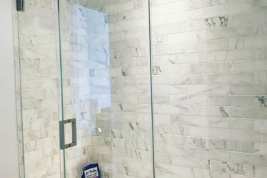 Mid-sized minimalist bathroom photo with a hinged shower door