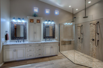 Mid-sized minimalist master beige floor double shower photo in Phoenix with shaker cabinets, white cabinets, a one-piece toilet, beige walls, an undermount sink, granite countertops and a hinged shower door