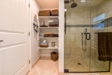 Alcove shower - mid-sized transitional 3/4 porcelain tile and beige floor alcove shower idea in DC Metro with flat-panel cabinets, beige cabinets, gray walls, a vessel sink, granite countertops, a hinged shower door and gray countertops