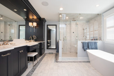 Design ideas for a large contemporary ensuite bathroom in Boston with beaded cabinets, dark wood cabinets, a freestanding bath, a built-in shower, a one-piece toilet, white tiles, marble tiles, blue walls, marble flooring, a submerged sink, engineered stone worktops, white floors, a hinged door and white worktops.