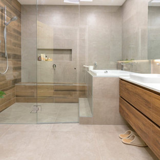 Large contemporary master wet room bathroom in Melbourne with beige tile, porcelain tile, porcelain floors, engineered quartz benchtops, beige floor, flat-panel cabinets, medium wood cabinets, a vessel sink, white benchtops, a japanese tub, an open shower, a shower seat, a double vanity and a floating vanity.