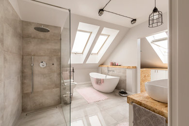Example of a large trendy master white tile and cement tile gray floor and marble floor bathroom design in Los Angeles with a one-piece toilet, white walls, a vessel sink, wood countertops, flat-panel cabinets and white cabinets