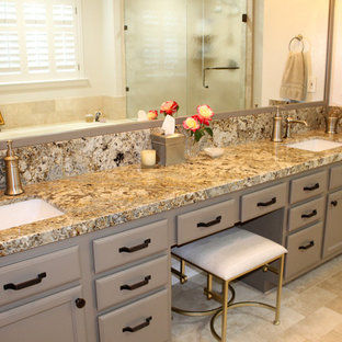 Example of a large transitional master beige tile and travertine tile travertine floor and beige floor corner shower design in Los Angeles with raised-panel cabinets, beige cabinets, a hot tub, a two-piece toilet, beige walls, an undermount sink, granite countertops and a hinged shower door