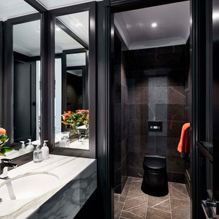 Design ideas for a contemporary bathroom in Sydney with black tile, black walls, an undermount sink, an alcove shower, a one-piece toilet, marble, marble floors, marble benchtops, brown floor and white benchtops.