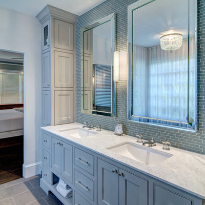 Example of a large classic master blue tile and glass tile porcelain tile freestanding bathtub design in Atlanta with an undermount sink, recessed-panel cabinets, blue cabinets, granite countertops and white walls
