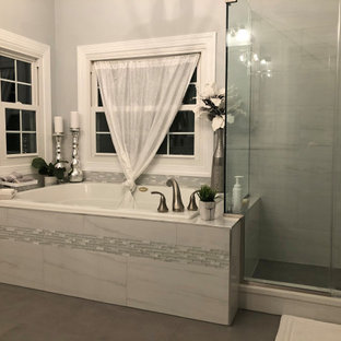 Example of a mid-sized transitional master gray tile and marble tile yellow floor and double-sink bathroom design in Baltimore with shaker cabinets, white cabinets, a two-piece toilet, gray walls, an undermount sink, quartz countertops, white countertops and a built-in vanity