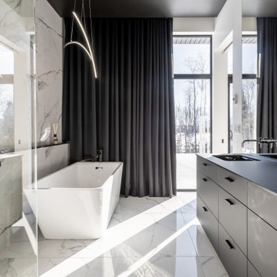 Large minimalist master black and white tile and ceramic tile ceramic tile, multicolored floor and double-sink bathroom photo in New York with black cabinets, multicolored walls, a drop-in sink, quartz countertops and black countertops