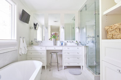 Large trendy master white tile and porcelain tile porcelain tile and white floor bathroom photo in Toronto with furniture-like cabinets, white cabinets, gray walls, an undermount sink, quartz countertops, a hinged shower door, white countertops and a one-piece toilet