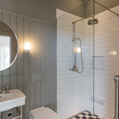 Small elegant 3/4 white tile and subway tile multicolored floor bathroom photo in Other with a wall-mount toilet, a console sink and gray walls