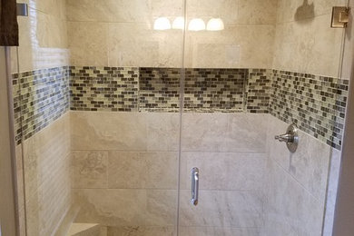 Photo of a small traditional shower room bathroom in DC Metro with an alcove shower, grey tiles, ceramic tiles, grey walls, ceramic flooring, grey floors and a hinged door.