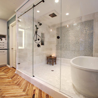 Example of a large trendy master beige tile and ceramic tile medium tone wood floor and brown floor bathroom design in Minneapolis with shaker cabinets, white cabinets, blue walls and an undermount sink