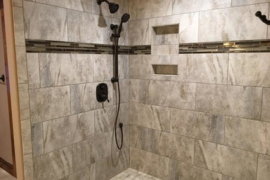 Example of a transitional master gray tile and ceramic tile mosaic tile floor and multicolored floor corner shower design in Seattle with multicolored walls