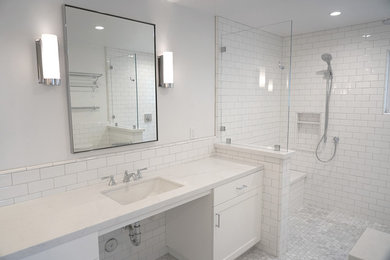 Inspiration for a mid-sized transitional white tile and subway tile mosaic tile floor and multicolored floor bathroom remodel in San Diego with shaker cabinets, white cabinets, a two-piece toilet, white walls, an undermount sink and white countertops