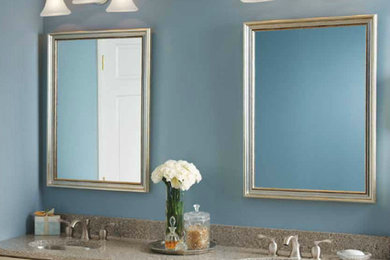 Inspiration for a timeless bathroom remodel in Burlington with raised-panel cabinets, light wood cabinets and blue walls