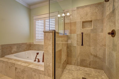 На фото: главная ванная комната среднего размера в стиле неоклассика (современная классика) с накладной ванной, угловым душем, керамогранитной плиткой, бежевыми стенами, полом из керамогранита, бежевым полом и душем с распашными дверями