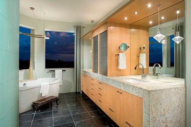 Inspiration for a large contemporary master black tile, blue tile and stone tile porcelain tile and black floor bathroom remodel in Phoenix with an undermount sink, flat-panel cabinets, light wood cabinets, terrazzo countertops, a one-piece toilet and white walls