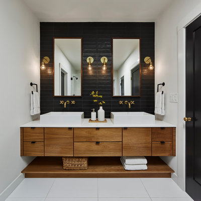 Bathroom - contemporary black tile white floor bathroom idea in San Francisco with flat-panel cabinets, medium tone wood cabinets, white walls, a vessel sink and white countertops