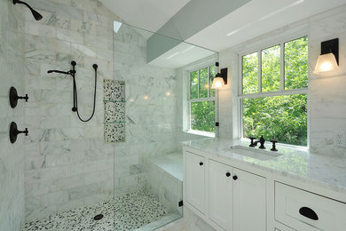 Example of a large transitional master gray tile, white tile and marble tile marble floor and white floor bathroom design in Los Angeles with an undermount sink, white cabinets, blue walls, shaker cabinets, marble countertops and a hinged shower door