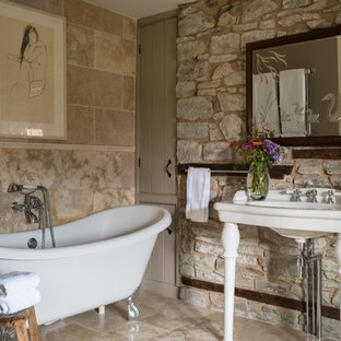 Inspiration for a small shower room bathroom in Other with a claw-foot bath, stone slabs, beige walls, beige tiles, a console sink and beige floors.