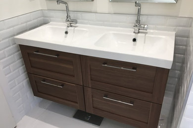 Inspiration for a small scandinavian master white tile and ceramic tile porcelain tile bathroom remodel in Toronto with shaker cabinets, medium tone wood cabinets, a one-piece toilet, white walls and an integrated sink