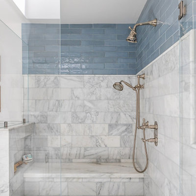 Inspiration for a mid-sized country master ceramic tile and gray tile mosaic tile floor wet room remodel in Los Angeles with white cabinets, a one-piece toilet, beige walls, an undermount sink, granite countertops, a hinged shower door, beige countertops and recessed-panel cabinets