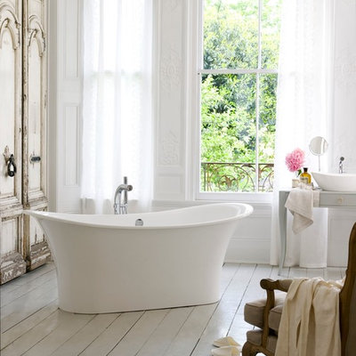 Large cottage chic master painted wood floor and white floor freestanding bathtub photo in Miami with white walls, a vessel sink, wood countertops and gray countertops