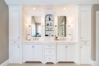 Example of a large cottage master ceramic tile bathroom design in Other with beaded inset cabinets, white cabinets, beige walls, a drop-in sink and granite countertops