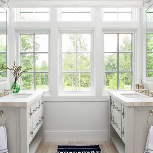 Inspiration for a mid-sized cottage master beige floor bathroom remodel in New York with shaker cabinets, gray cabinets, white walls, an undermount sink and beige countertops