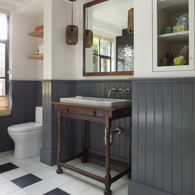 Example of a mid-sized eclectic master black tile and subway tile porcelain tile bathroom design in San Francisco with a console sink, furniture-like cabinets, dark wood cabinets, white walls, wood countertops and brown countertops