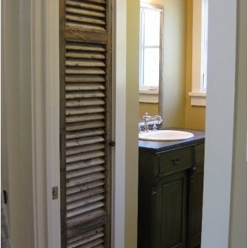 Antique shutter as linen closet door, antique sideboard as bathroom vanity
