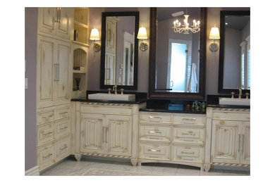Inspiration for a large traditional ensuite bathroom in Denver with raised-panel cabinets, distressed cabinets, grey walls, ceramic flooring, a built-in sink and engineered stone worktops.