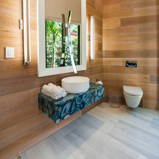 Inspiration for a large contemporary 3/4 bathroom in Miami with a vessel sink, a wall-mount toilet, white tile, brown walls, marble floors, onyx benchtops, grey floor and blue benchtops.
