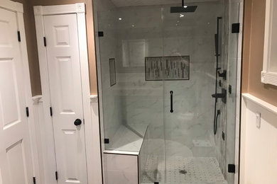 This is an example of a medium sized modern shower room bathroom in New York with an alcove shower, white tiles, porcelain tiles, beige walls and a hinged door.