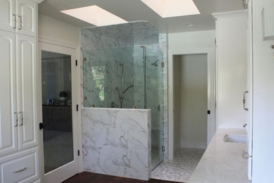 Inspiration for a mid-sized transitional gray tile, white tile and stone tile ceramic tile and white floor alcove shower remodel in Other with white walls, an undermount sink, quartzite countertops and a hinged shower door