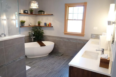 Bathroom - large transitional master beige tile, white tile and ceramic tile ceramic tile and gray floor bathroom idea in Chicago with raised-panel cabinets, dark wood cabinets, a one-piece toilet, beige walls and a drop-in sink