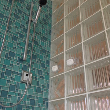 Argus pattern glass block shower wall with color glass tiles in a Lancaster Ohio