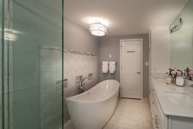 Mid-sized eclectic master multicolored tile and porcelain tile porcelain tile and multicolored floor bathroom photo in Chicago with recessed-panel cabinets, white cabinets, a two-piece toilet, gray walls, an undermount sink, quartz countertops, a hinged shower door and multicolored countertops