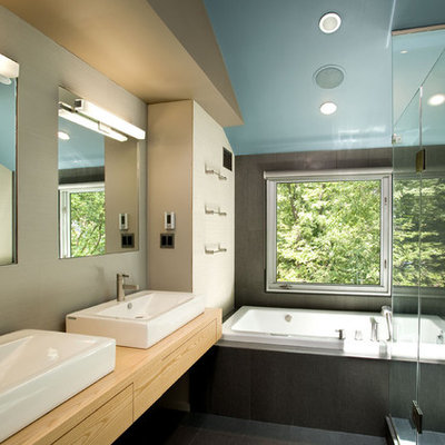 Example of a trendy drop-in bathtub design in DC Metro with a vessel sink