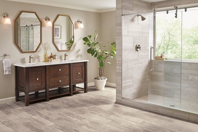 Large transitional master gray tile and porcelain tile vinyl floor and beige floor alcove shower photo in Other with shaker cabinets, dark wood cabinets, beige walls, an undermount sink, recycled glass countertops and a hinged shower door