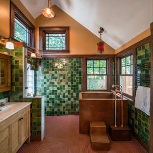 Bathroom - mid-sized craftsman master green tile bathroom idea in Boston with an undermount sink, furniture-like cabinets, medium tone wood cabinets, marble countertops and brown walls