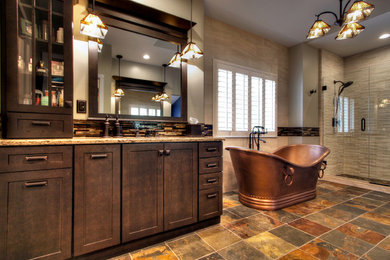 Example of a huge arts and crafts master multicolored tile and porcelain tile ceramic tile bathroom design in St Louis with shaker cabinets, dark wood cabinets, a one-piece toilet, beige walls, an undermount sink and quartzite countertops