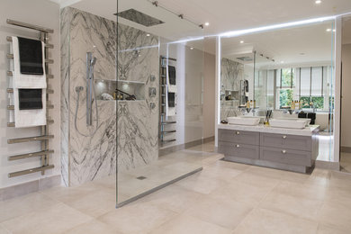 Photo of a contemporary bathroom in London with black and white tiles, porcelain tiles, porcelain flooring and grey floors.