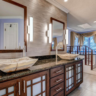 Inspiration for a large asian master bathroom in Denver with a vessel sink, shaker cabinets, medium wood cabinets, granite benchtops, a japanese tub, a corner shower, a two-piece toilet, gray tile, ceramic tile, purple walls and ceramic floors.