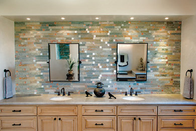 Mid-sized transitional kids' multicolored tile and mosaic tile bathroom photo in Albuquerque with an undermount sink, raised-panel cabinets, light wood cabinets, marble countertops and white walls