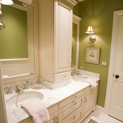 Inspiration for a timeless bathroom remodel in Chicago with an undermount sink, raised-panel cabinets and beige cabinets
